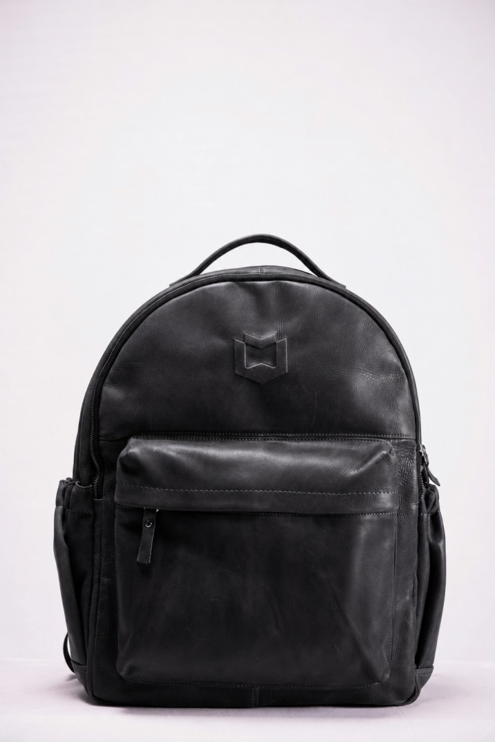 The same backpack in black leather