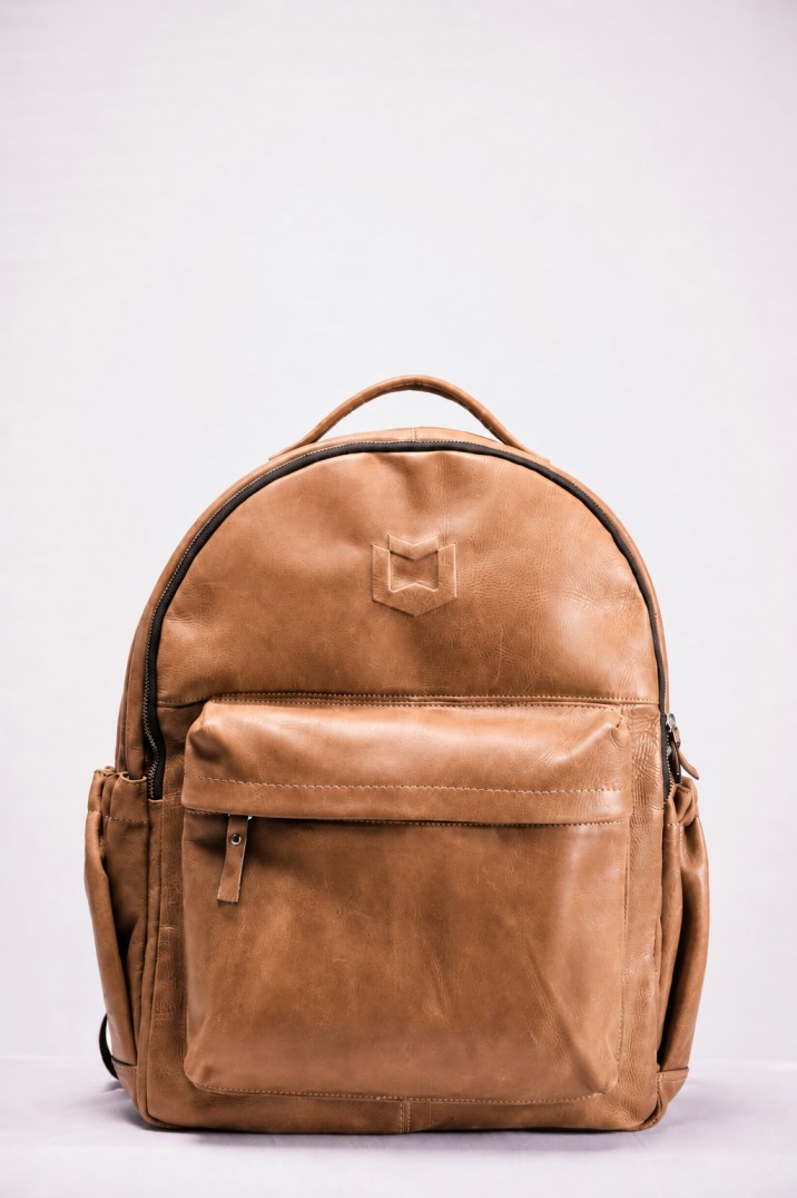 Tan leather backpack a customer is asking about
